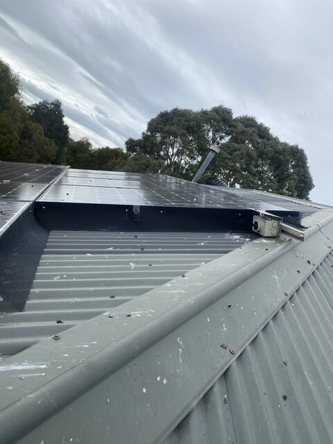 Bird proofing mesh fitted around the edge of rooftop solar panels